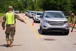 U.S. Army 1st Lt. Nicholas Barnett, 48th Infantry Brigade Combat Team, Georgia National Guard, directs traffic at a COVID-19 mobile testing site in Albany, Georgia, May 19, 2020. Senior Master Sgt. Roger Parsons