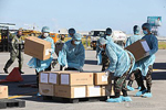 Thousands of aid packages donated by the People's Republic of China are unloaded at the Villamor Air Base in Pasay City on March 21, 2020. The donation includes assorted medical supplies, personal protective equipment, and testing kits for coronavirus. Toto Lozano