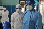 Healthcare workers wearing personal protective equipment while caring for patients with coronavirus infection in the Indian state of Kerala. Javed Anees