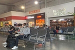 People wearing masks at Monterrey Airport due to the COVID-19 pandemic. Davidmejoradas